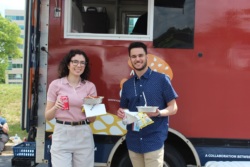 Photo of couple in front of food truck